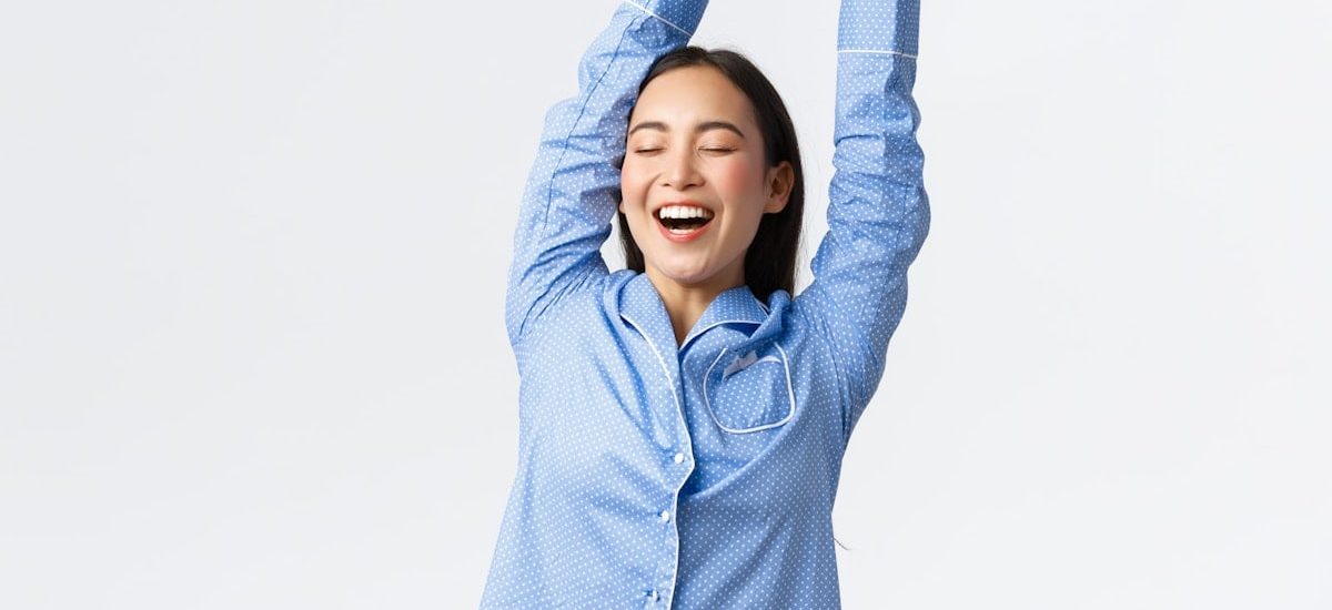 a woman with her arms in the air