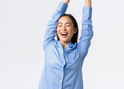 a woman with her arms in the air